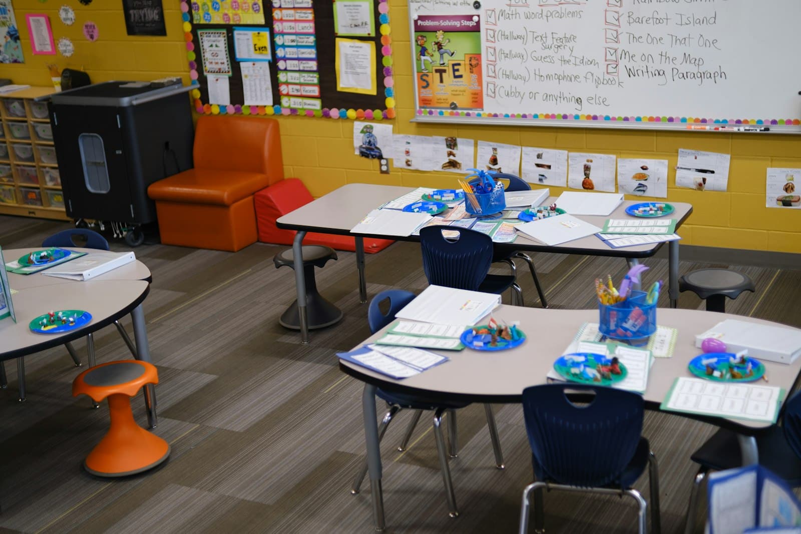 Classroom tables with materials set out for the day